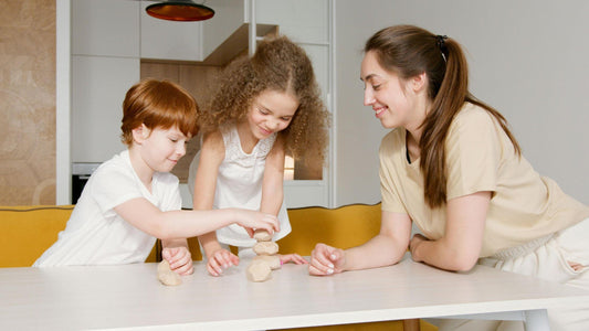 Kids and parents enjoying outdoor crafts together, highlighting the joy of family bonding through creative games.