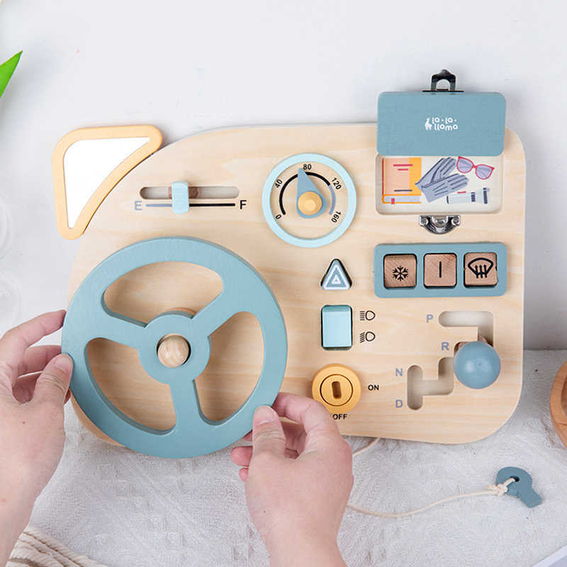 person playing with busy board