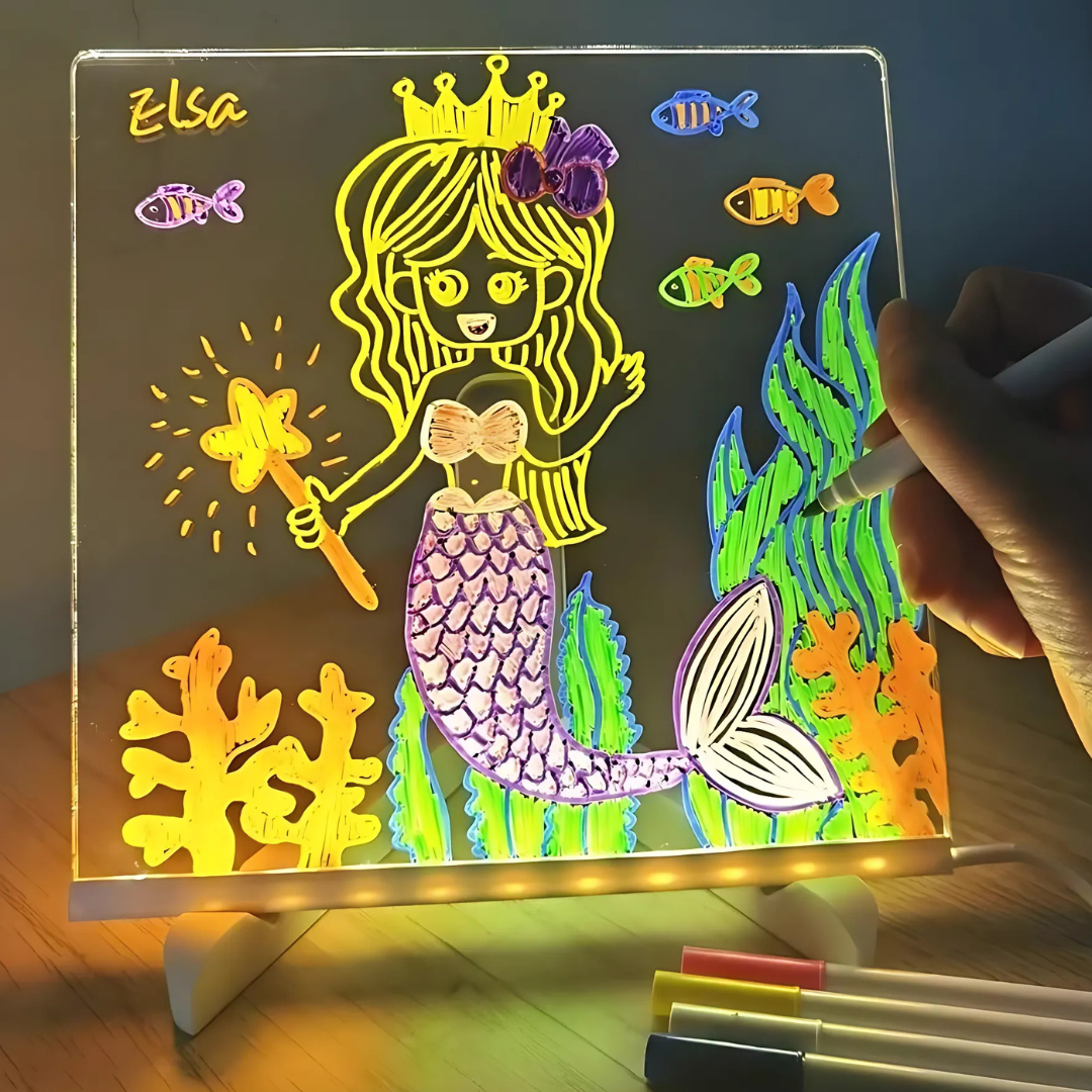 someone drawing on the glowing board
