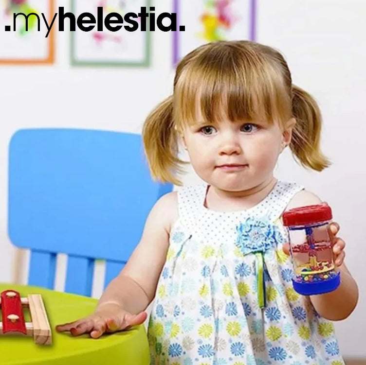 child holding a rattle